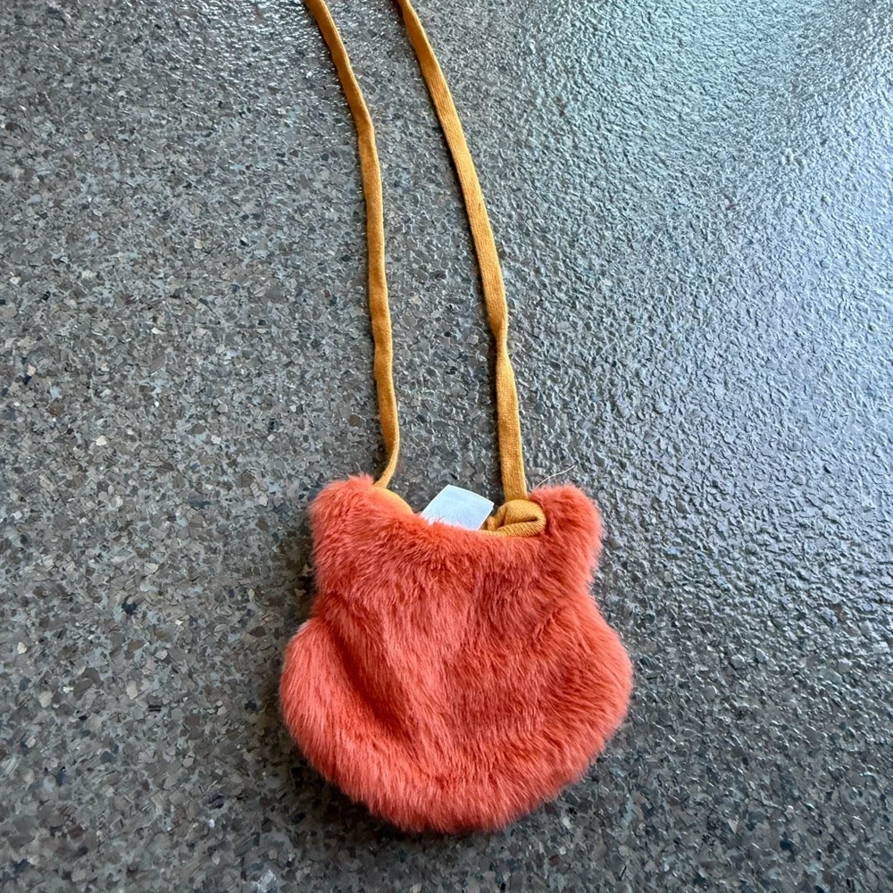 A cute Crossbody purse with a fox face